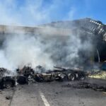 Semi-truck driver survived crash off overpass and explosion, highways closed for hours