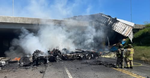 Semi-truck driver survived crash off overpass and explosion, highways closed for hours